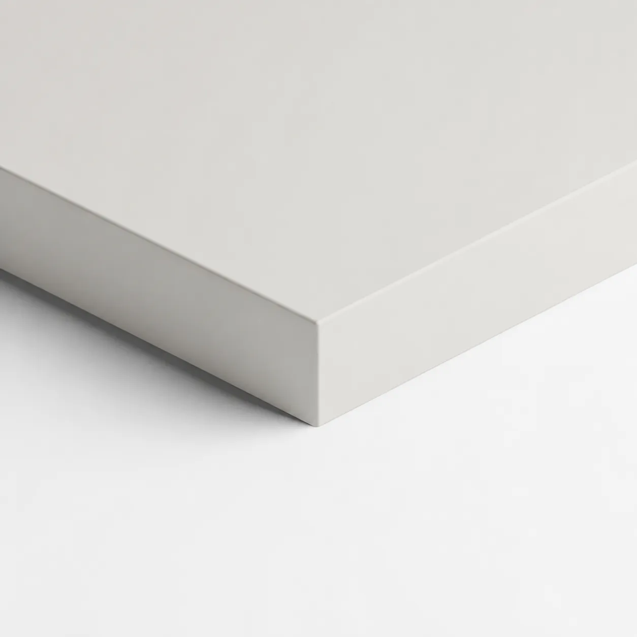 Seda surface — a pale matte lacquer sample board, edge in view