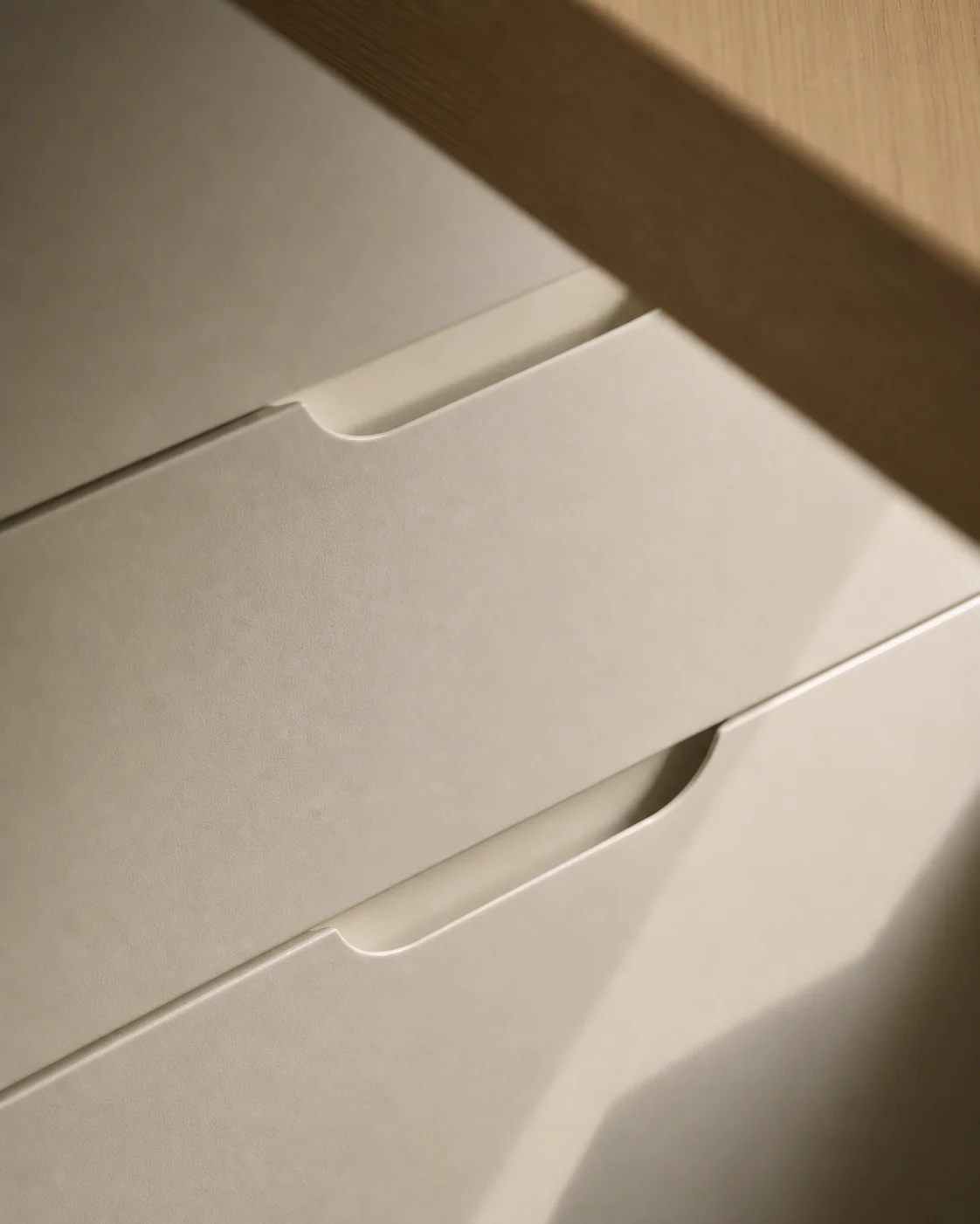 Close Velora concept study of Seda Chalk wardrobe drawer fronts with integrated finger pulls and a Veta Miel oak shelf