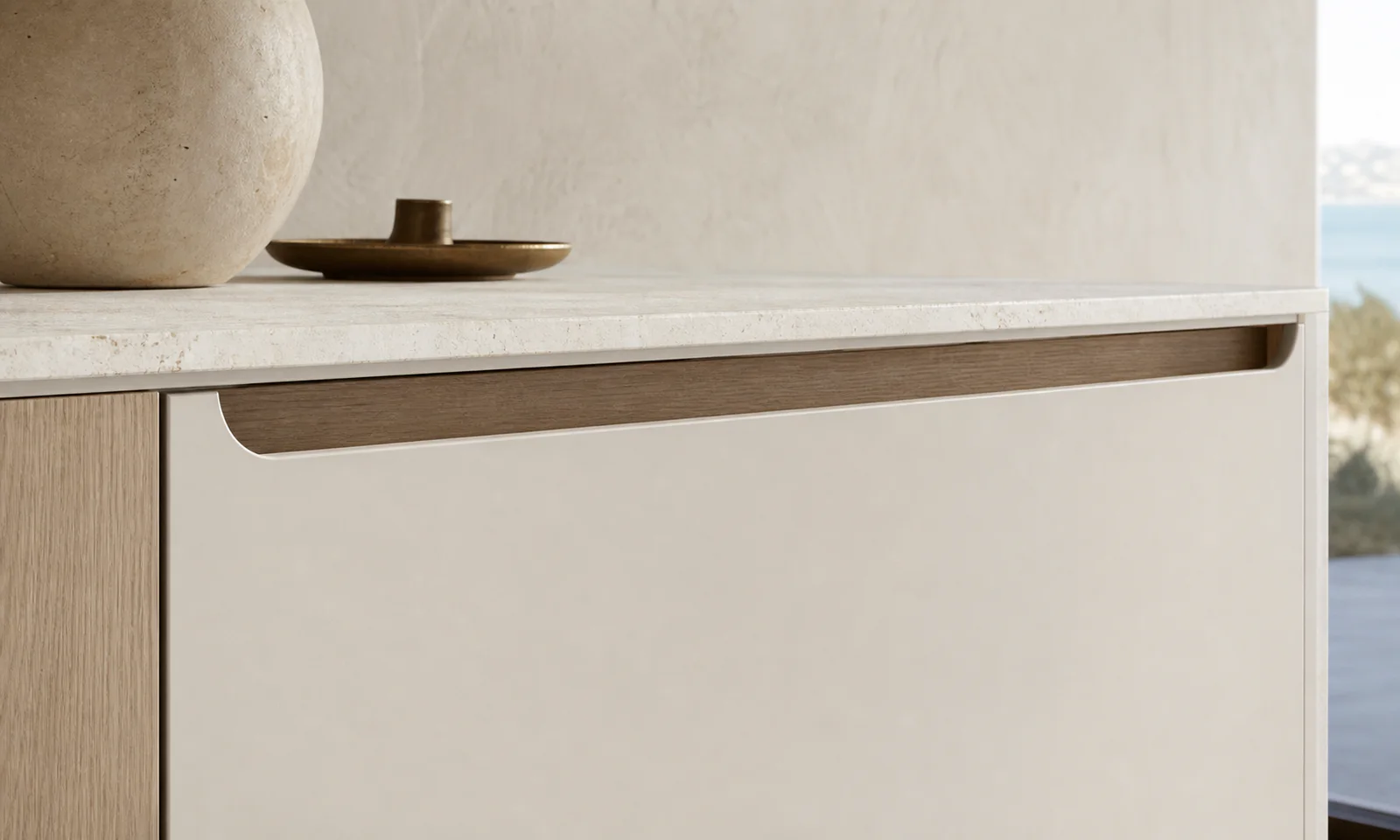 Velora concept — a recessed rail pull along a run of drawer fronts